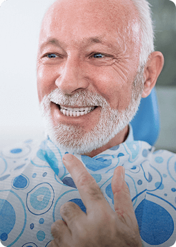A man in a chair, exuding a sense of relaxation and ease in a casual setting.