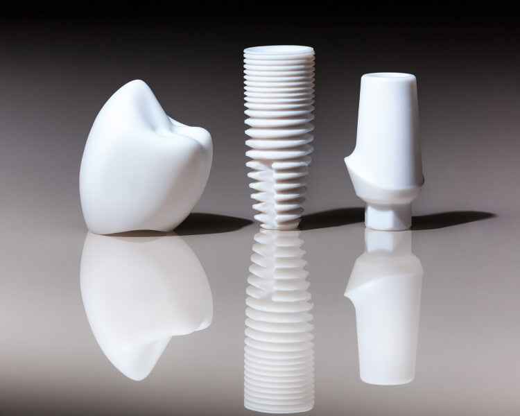 A close-up of dental implants and crowns, showcasing their design and materials for restorative dental procedures.