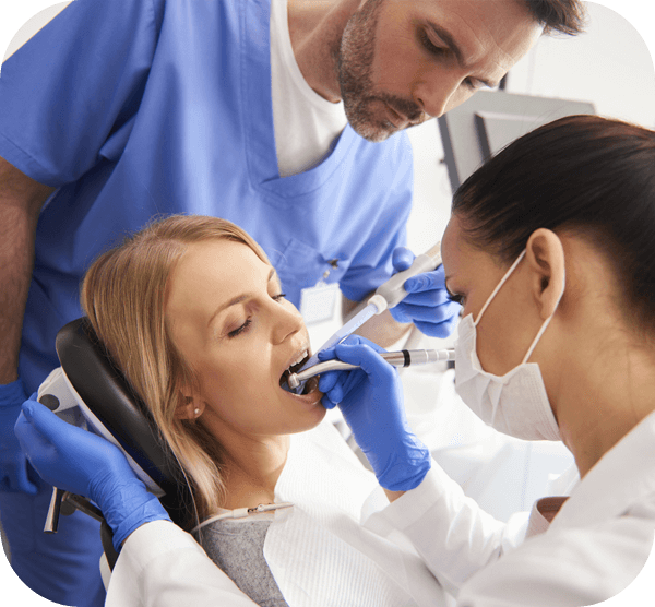 A woman sitting in a dentist chair, looking relaxed as she prepares for her dental appointment.